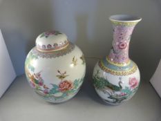 A Chinese famille rose ginger jar and a Chinese famille rose bottle vase with matching makers mark