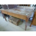 An antique pine kitchen table with single drawer