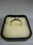 9ct Diamond Solitaire with accent diamonds either side