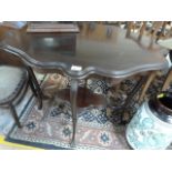 An unsual mahogany shaped two tier occasional table