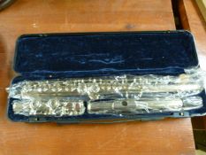 A cased and unused flute