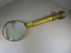 Large brass magnifying glass - glass A/F - Barley twist stem handle leading to a decorative end.