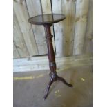 A Tall mahogany plant stand