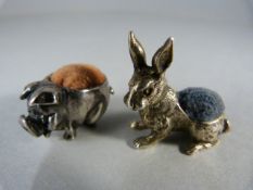 Two Novelty pin cushions - possibly silver but no hallmarks - 1 in the form of a Hare and the