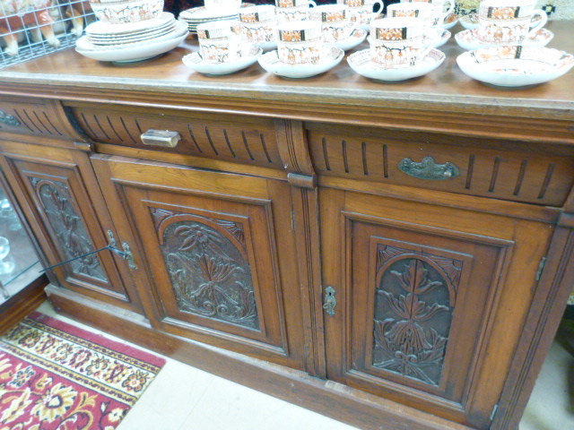 An oak sideboard with two cupboards and three drawers over - Image 2 of 3