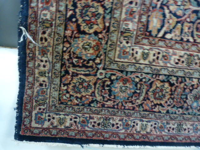 A large blue ground hand made rug - Image 2 of 7