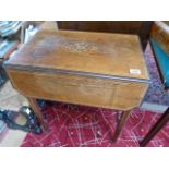 Unusual inlaid drop leaf table (floral inlay) on tapering legs with castors