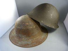 Two tin military helmets