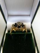 9ct Sapphire & Diamond Cluster ring. Six Dark Sapphires with three diamonds in a illusion setting.