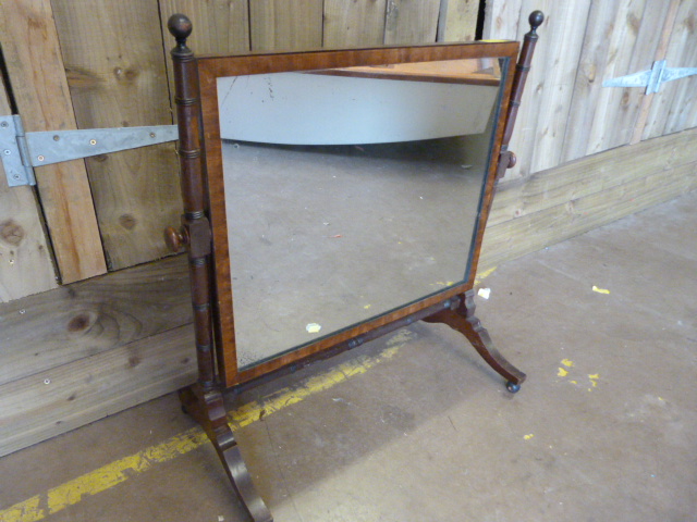 A large Edwardian bedroom mirror