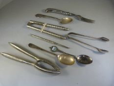 Pair of hallmarked silver sugar nips and a hallmarked silver teaspoon along with some other pieces