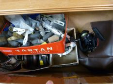 Box containing various fishing gear - reels and weights etc