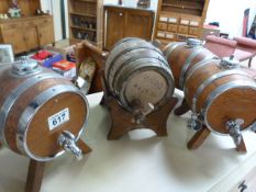 Four small barrels on stands