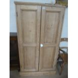 An Antique pine two door wardrobe A/F