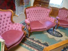 Two seater button back sofa upholstered in pink on mahogany frame with cabriole legs and extensive