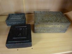 Leather bound trinket box, carved wooden trinket box and a brass impressed trinket box