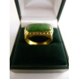 24ct (999.9) chinese saddle ring set with imperial jade. Approx 16.7mm x 7.5mm across Size Q total