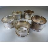 Five various hallmarked silver napkin rings - total weight 161g