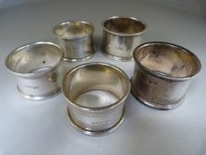 Five various hallmarked silver napkin rings - total weight 161g