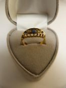 A Good Diamond and Sapphire ring set in 18ct Gold