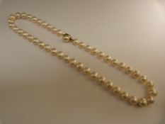 Freshwater cultured pearl necklace. 18" long approx 9.75mm pearls with 9ct Gold clasp by Metall