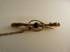 Yellow metal victorian bar brooch with Doublet Amethyst coloured stone