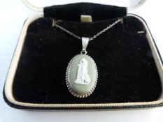 Early Silver (unmarked) green Wedgwood Jasperware pendant on original sterling chain. Depicting a