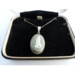 Early Silver (unmarked) green Wedgwood Jasperware pendant on original sterling chain. Depicting a