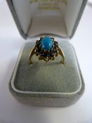 Vintage 1980's 9ct Yellow Gold Sapphire and Turquoise cluster ring - The centre oval cabachon