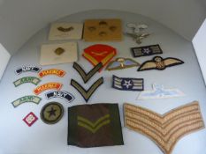 Collection of cap badges and sew on Regimental badges to include the Dorsetshire Regiment, PIP and