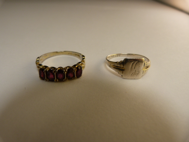 Hallmarked silver ring and one other set with Garnets