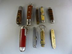 A quantity of pen knives - to include some wooden etc and a Boy Scout whistle