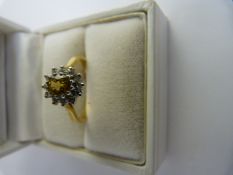 18ct Yellow Gold, yellow sapphire and Diamond cluster ring. The Yellow oval centre stone in approx