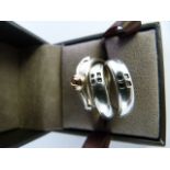 Pair of interlocking silver rings by Clogau in comteporary design and 1 other Clogau ring of similar