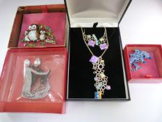 Three Boxed Butler and Wilson pieces of costume jewellery and one other piece