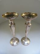 A pair of hallmarked silver candle sticks Birmingham 1914 by Henry Williamson Ltd.