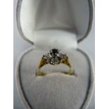 18ct Yellow Gold Sapphire and Diamond star cluster ring. Central sapphire approx 3.1mm in