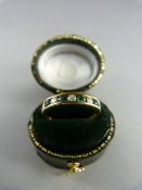 18ct Yellow Gold ring set with four emeralds and three diamonds Gross weight 2.6g