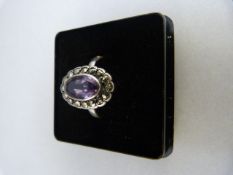 Vintage silver Amethyst and marcasite ring. the approx 10mm x 6.3mm stone is a little rubbed on