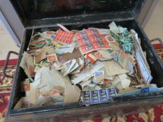 Tin containing various loose stamps and seals