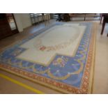 Axminster beige ground rug with floral border approx 613cm x 336cm (21" x 11")