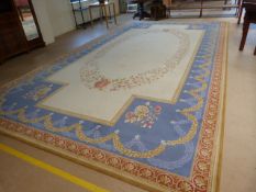Axminster beige ground rug with floral border approx 613cm x 336cm (21" x 11")