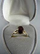 9ct Yellow Gold Solitaire garnet ring, oval garnet approx 8.1mm x 6mm across. Size UK - K US - 5.