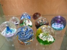 Quantity of Caithness paperweights to include a Liskeard paperweight