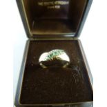 9ct Yellow Gold emerald and Diamond crossover style ring with 5 small emeralds and a 1 tiny