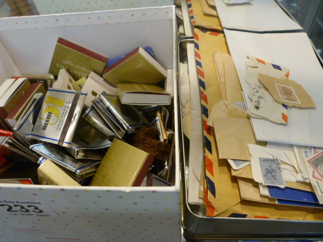 Box containing various stamps and cigarette boxes