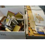 Box containing various stamps and cigarette boxes