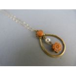 9ct Gold Coral and Pearl pendant hung on a 16" chain. A carved 7.7mm coral flower and a 4.8mm