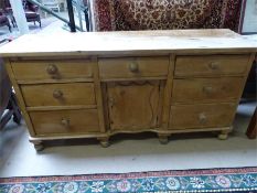 Long antique pine desk with three cupboards under