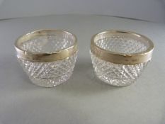 Three cut glass salts with hallmarked silver rims 2- London 1914 the other London 1905